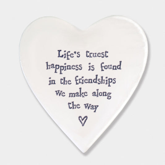 Life's Truest Happiness Quote on white coaster and white background