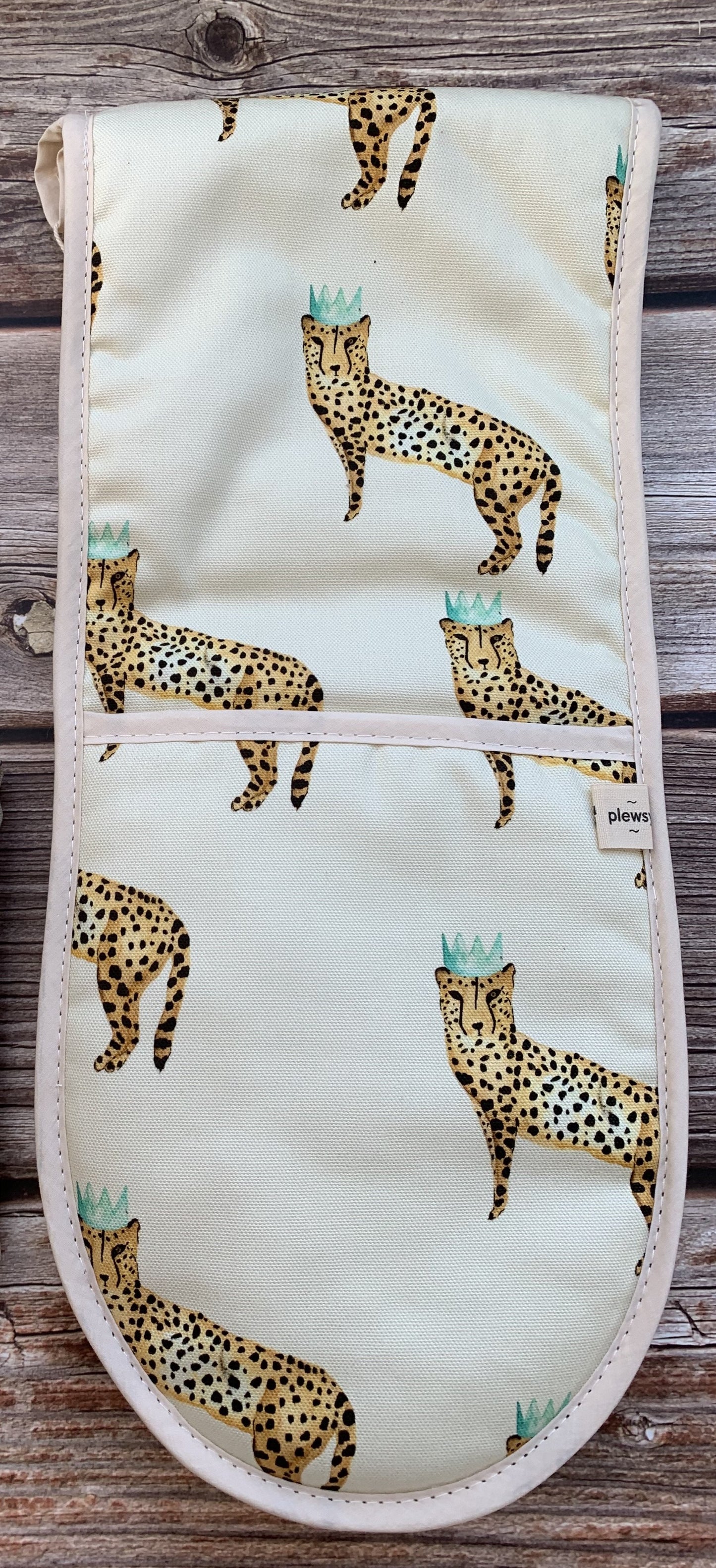 Cheetah Print Oven Glove on wooden background