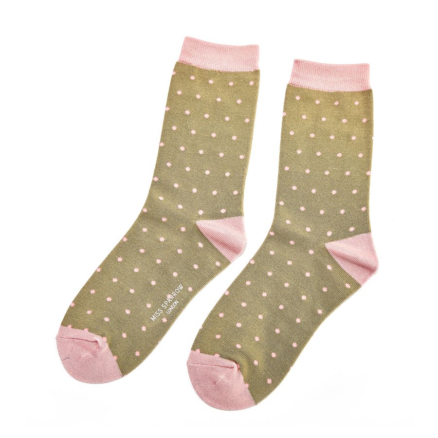 olive green and pink socks with polka dots on a white background