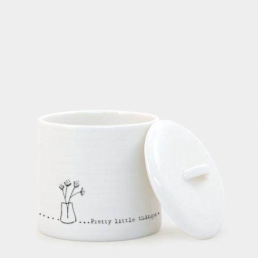 Pretty little things white pot with lid on the side