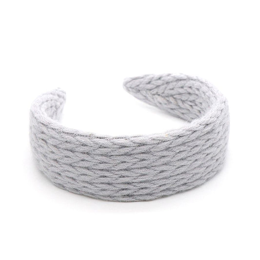 grey knitted headband on a white background