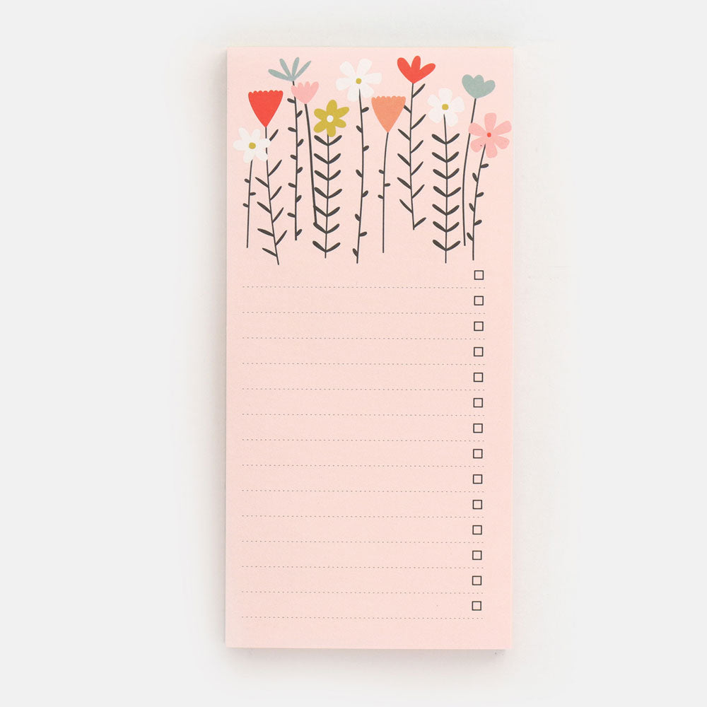 pink floral notepad on a white background