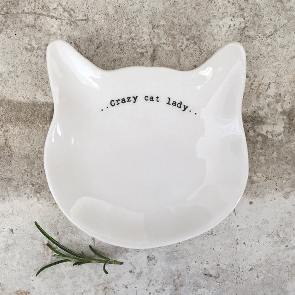 White Cat shaped porcelain dish with the words crazy cat lady on a stone background