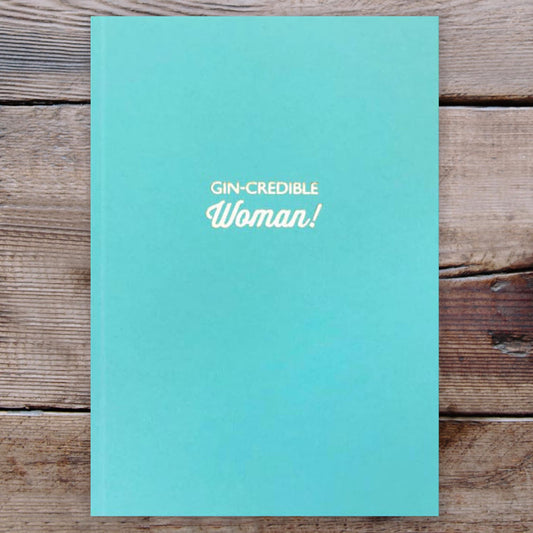 Gin-Credible Teal Notebook on a wooden background