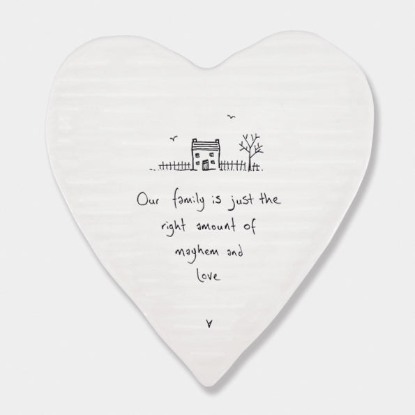 White porcelain heart with family saying in black 