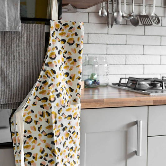 leopard print apron hanging in a kitchen setting 