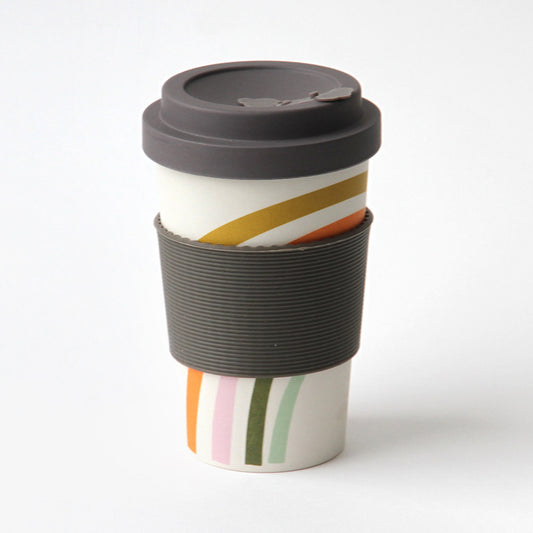Rainbow and black travel coffee cup on a white background
