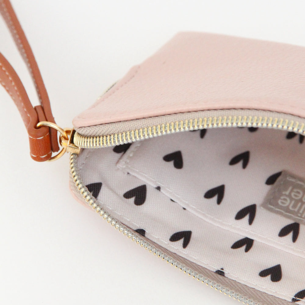 inside view of pale pink purse and zip