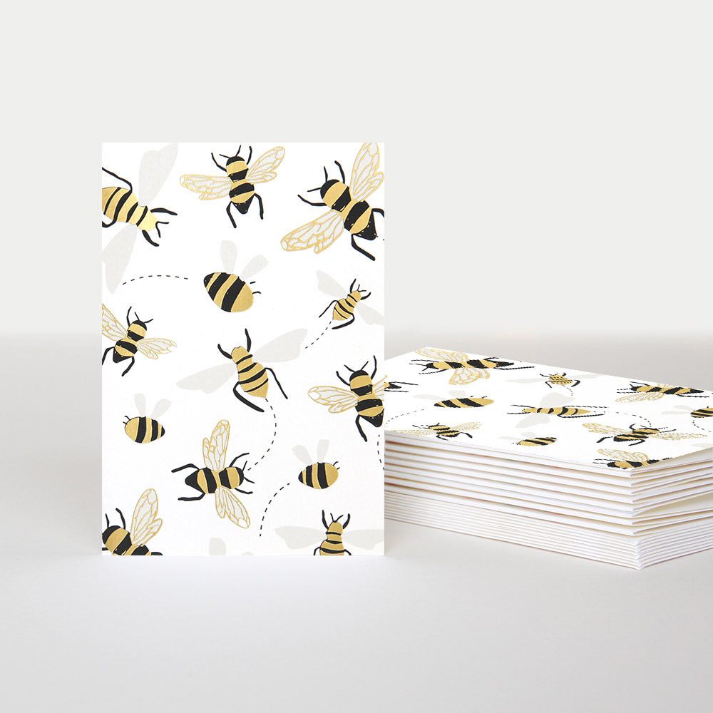 bee notecard standing alone with a stack of matching cards next to it 
